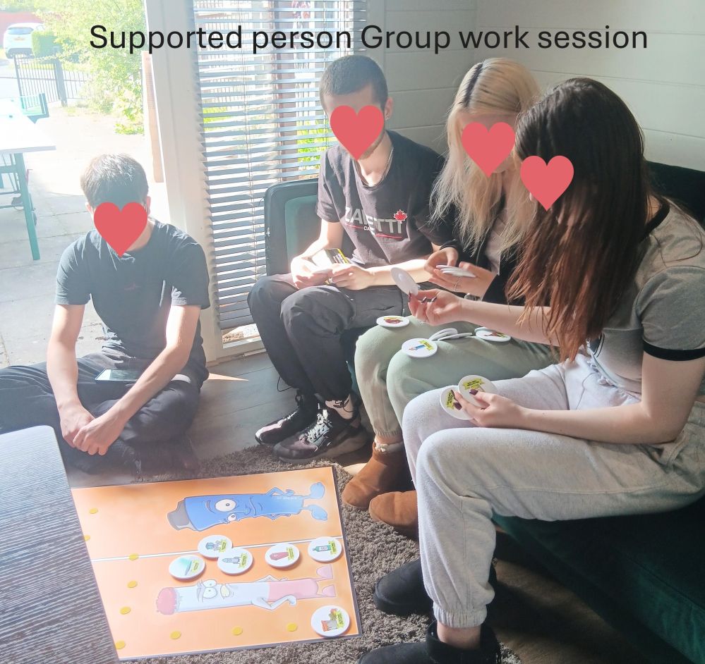 Four young people sat around an interactive board sticking the relevant harms associated to the cigarette and vaping image